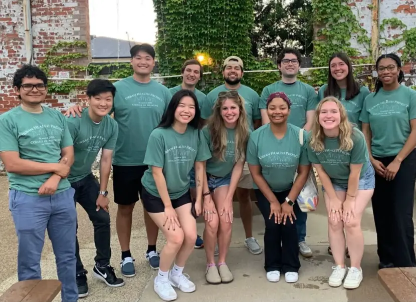 12 2025 UHP alumni at the MadTree Summer Social in a group photo